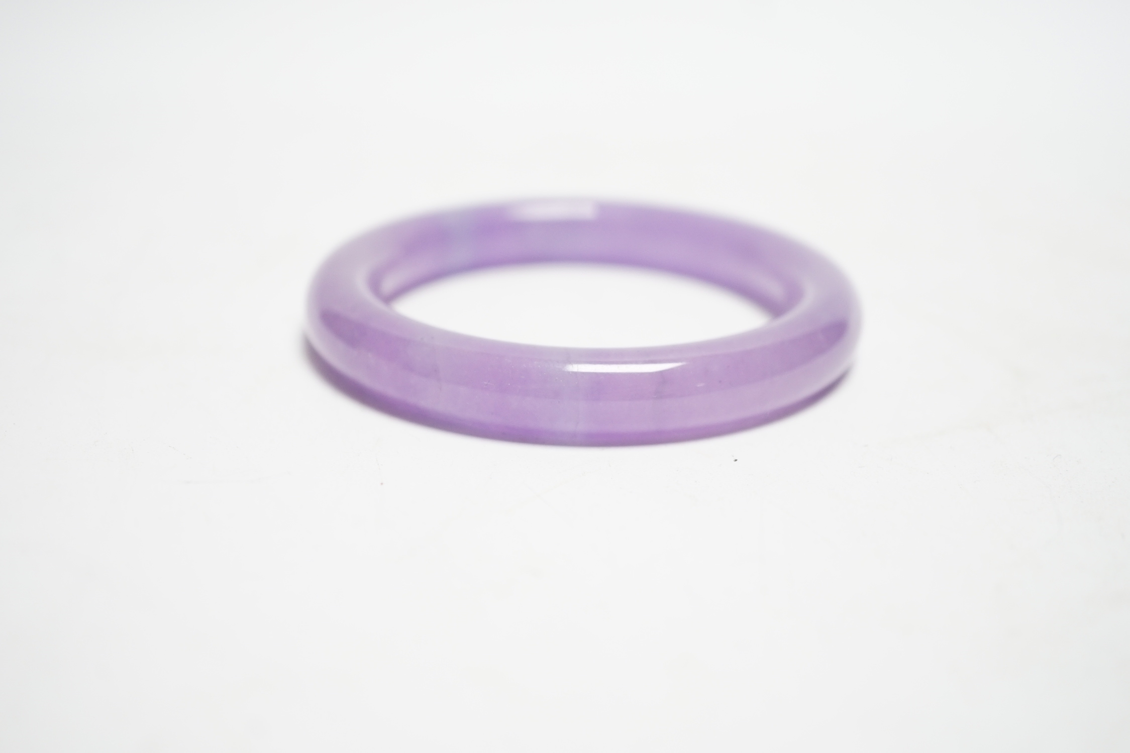 A Chinese lavender hardstone bangle